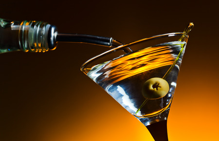 dry martini with olives ,focus on a berryの写真素材