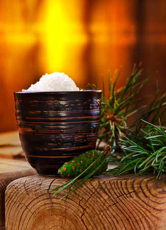 Sea salt with coniferous aroma on an old wooden tableの写真素材