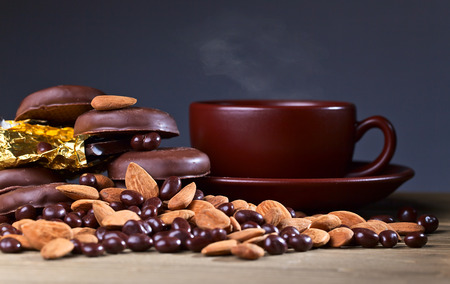 black chocolate and nuts on wooden tableの写真素材