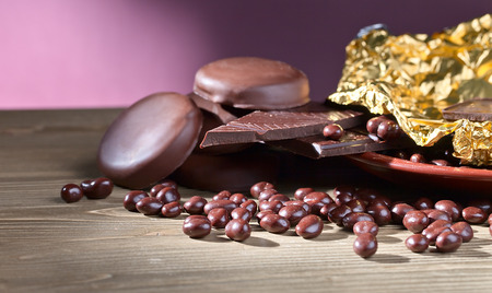 black chocolate on a old wooden tableの写真素材