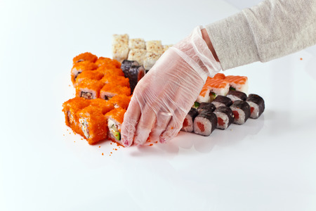 restaurant  staff lays the table with seafoodの写真素材