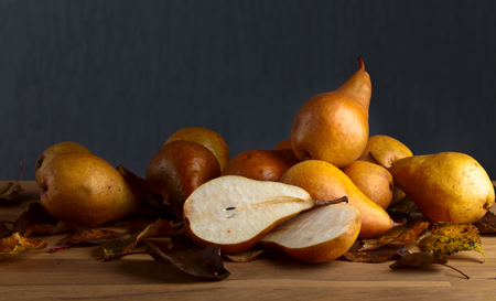 Juicy ripe pears on a wooden tableの写真素材