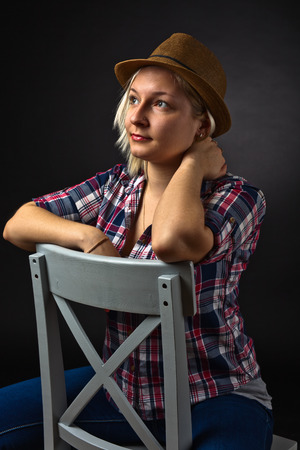 portrait of young woman in checkered  shirtの写真素材