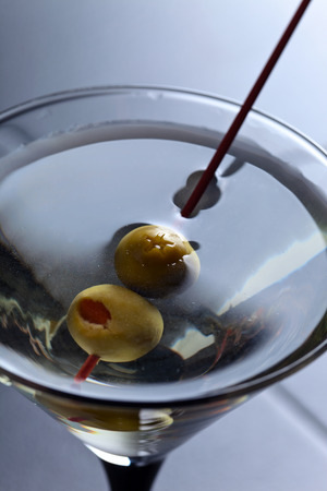 glass of martini, focus on a olivesの写真素材