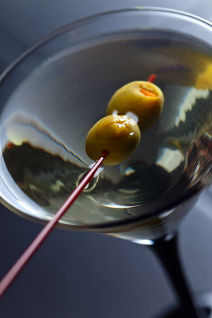 glass of martini, focus on a olivesの写真素材