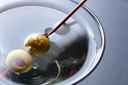 glass of martini, focus on a olivesの写真素材