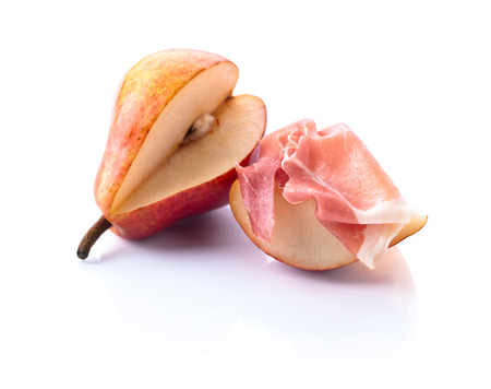 Spanish jamon with pear isolated on white backgroundの写真素材