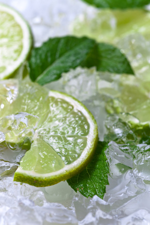 lime slices with ice and peppermint leavesの写真素材