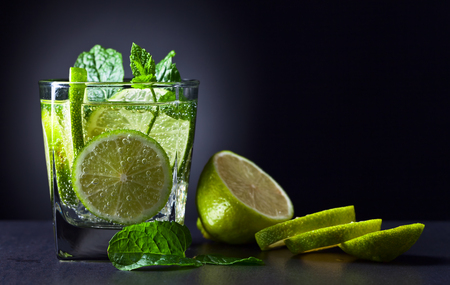 cocktail with lime, ice and peppermint leavesの写真素材