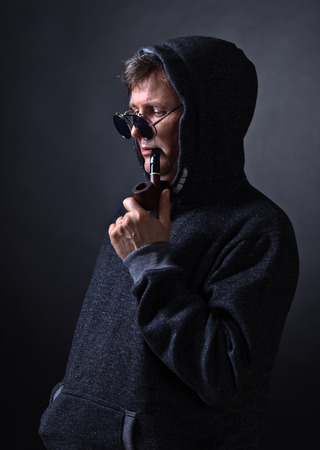 Portrait of a man with a Smoking pipe , studio shotの写真素材
