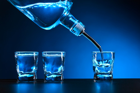 vodka in bar on a black tableの写真素材