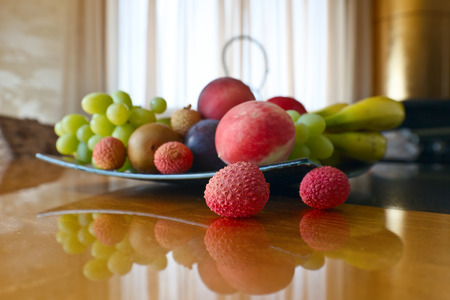 Ripe tropical fruits on a kitchen tableの写真素材