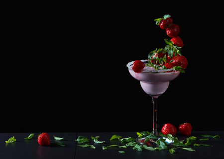 strawberry cocktail with berries and peppermint leavesの写真素材