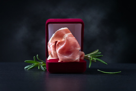 jamon with rosemary on a dark backgroundの写真素材