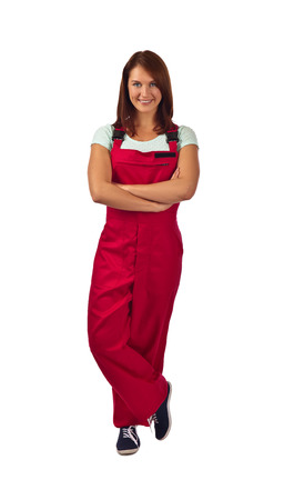 Young happy woman in red overalls  , isolated on a white backgroundの写真素材