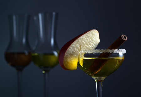 sweet liquor with apple and cinnamon stickの写真素材