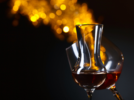 Glasses of alcoholic drink on a dark backgroundの写真素材