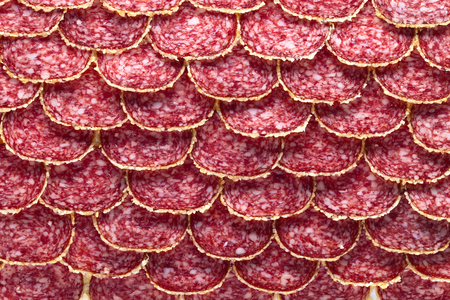 Salami sausage slices , focus on a centerの写真素材