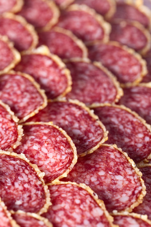 Salami sausage slices , focus on a foregroundの写真素材