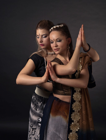 Dancing young women in the national Indian costume