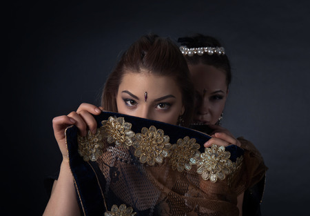 Two young women in the national Indian costumeの写真素材