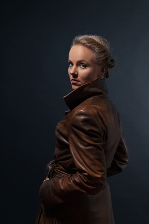 Portrait of young beautiful woman in leather coatの写真素材