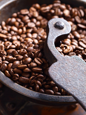 old coffee grinder and roasted coffee beansの写真素材