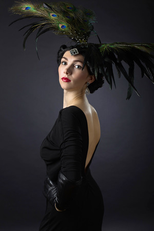 Portrait of young beautiful woman in retro style.Beautiful woman with perfect makeup and hair .
