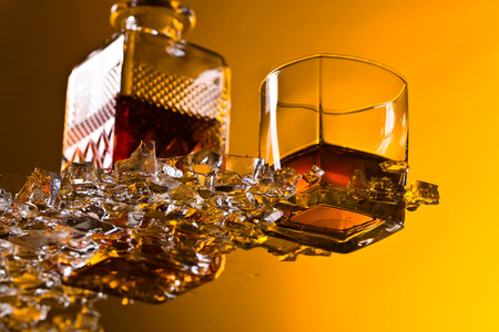 Glass of Whiskey with ice.View from the bottom .の写真素材