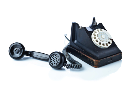 Old black phone isolated on a white background.の写真素材