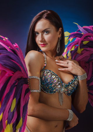  Beautiful Girl in carnival costume. Beautiful professional  make-up  , perfect headdress with natural feathers and rhinestones.の写真素材
