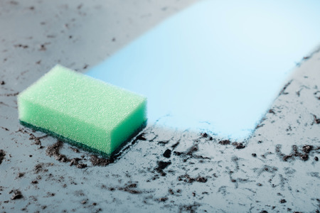 Dirty glass and a sponge . Copy space for your text.の写真素材