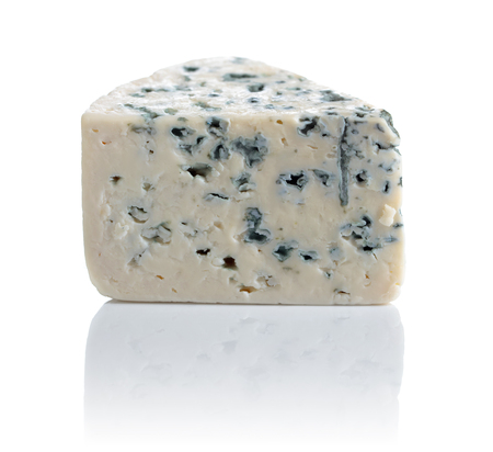 Wedge of soft blue cheese with mold isolated on white background. の写真素材