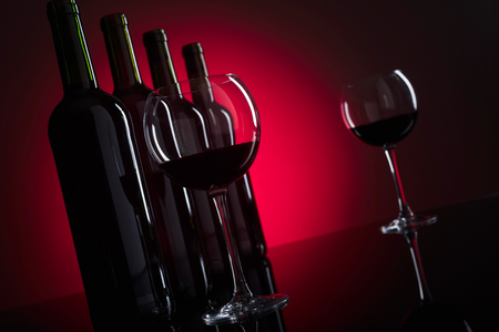 Glasses and bottles of red wine, copy space for your text.の写真素材