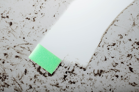 Dirty glass and a sponge . Copy space for your text.の写真素材