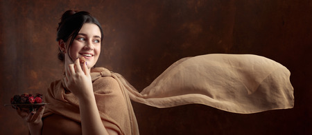 Portrait of a young beautiful girl with chocolate and candy.の写真素材