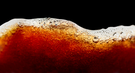 Close up of coffee splashes on a black background. Saved clipping path.の写真素材