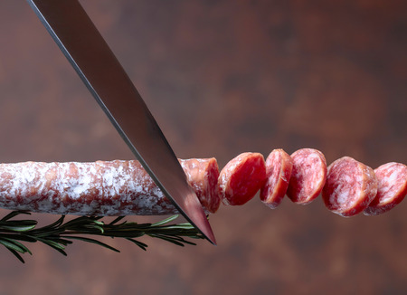 Close up of smoked salami with rosemary. Copy space.の写真素材