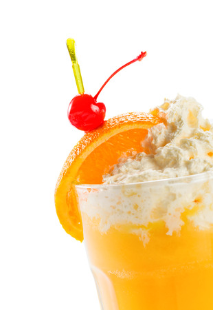 Orange juice with vanilla ice cream and cherry, isolated on white background.の写真素材
