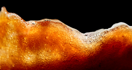 Close up of coffee splashes on a black background. Saved clipping path.の写真素材