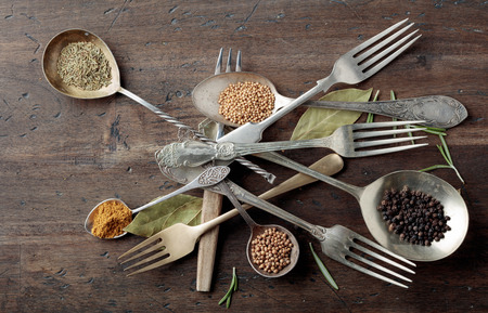Various herbs and spices on a old wooden table. Top view.の写真素材
