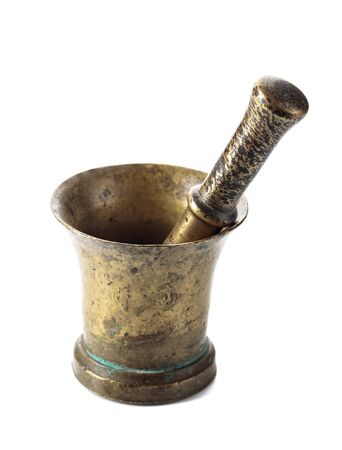 Vintage brass mortar and pestle isolated on a white background.の写真素材