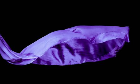 Smooth purple transparent cloth isolated on black background. Texture of flying fabric.の写真素材