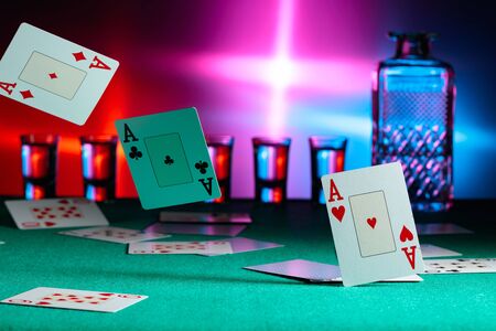 Cards fall on a casino table . Concept of gambling. Copy space.