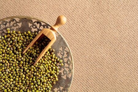 Raw uncooked green lentils (lens culinaris). Top view with copy space.の写真素材