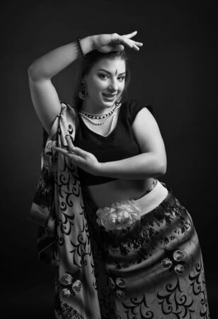 Beautiful woman dancer in traditional indian clothing. Black and white.の写真素材