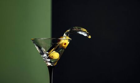 Martini with green olives.  Copy space for your text.の写真素材