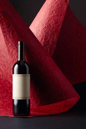 Unopened red wine bottle with empty label. Copy space.の写真素材