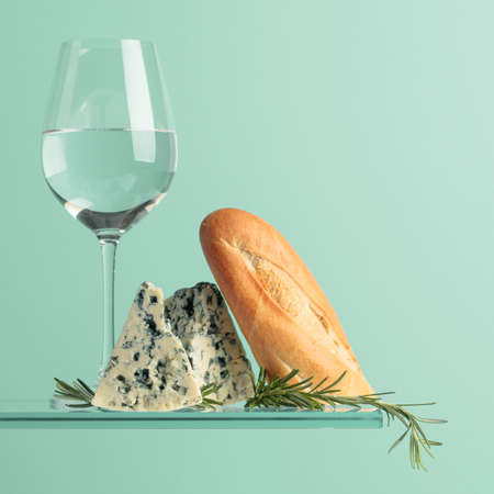 Blue cheese with bread, white wine and rosemary. Copy space.の写真素材