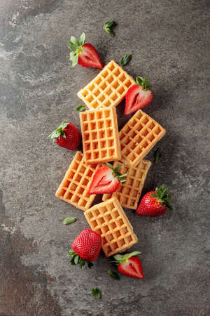 Waffles with fresh juicy strawberries, view from above.の写真素材